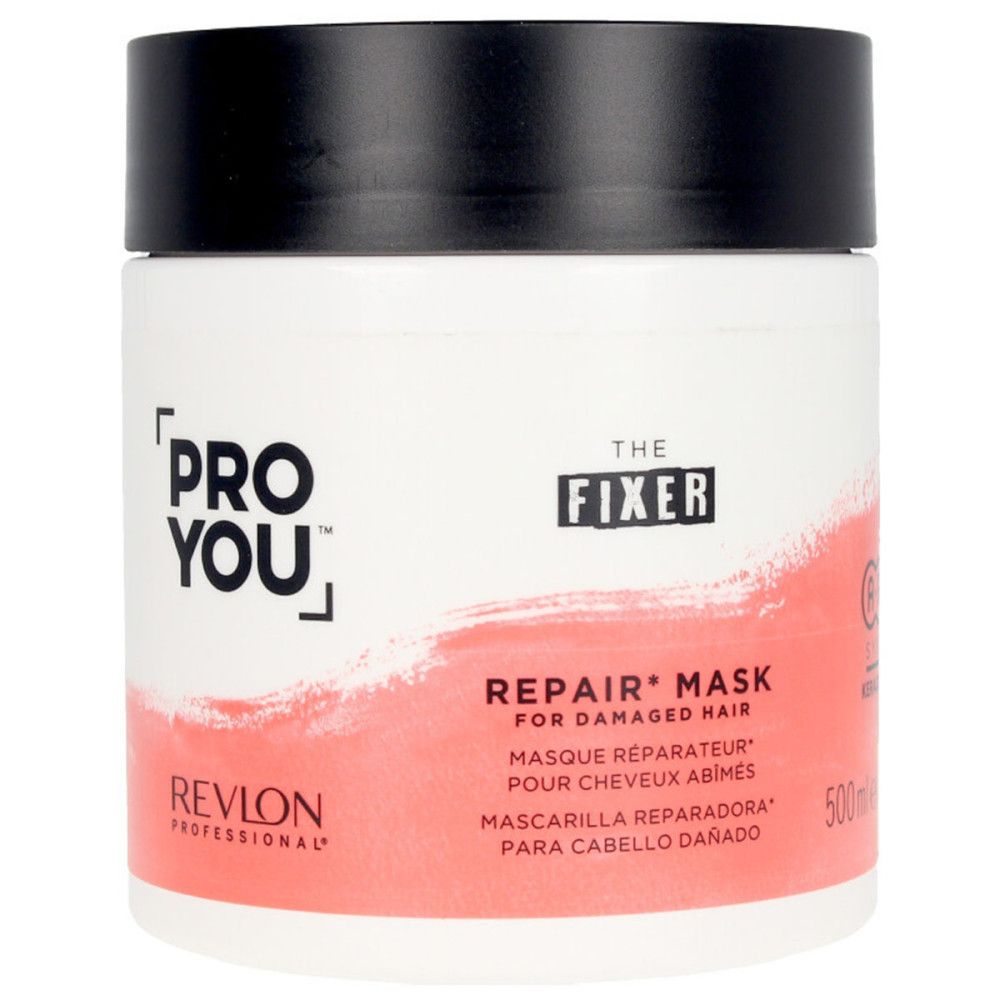 Weißer Tiegel mit schwarzem Deckel. Aufschrift: PRO YOU, THE FIXER, REPAIR MASK, REVLON. Roter Hintergrund.