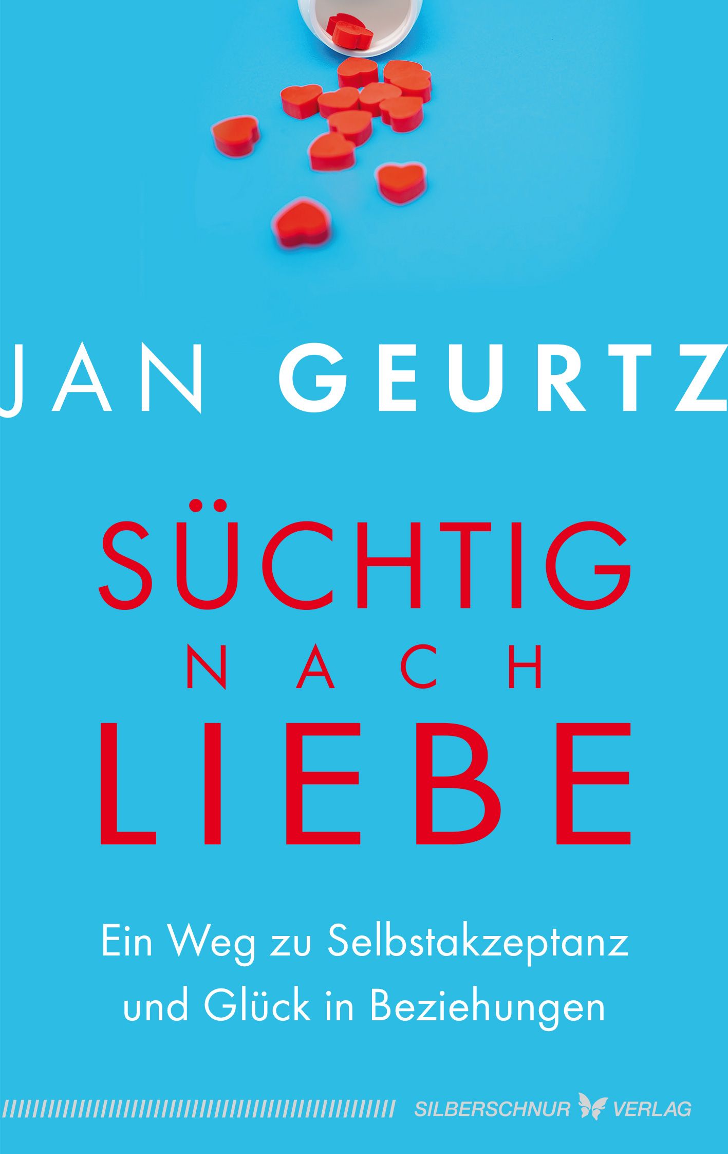 Buchcover mit Titel "Süchtig nach Liebe". Autor: Jan Geurtz. Rote Schrift auf blauem Hintergrund. Herzförmige Süßigkeiten.