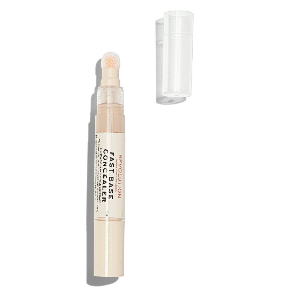 Beige Concealer-Stift mit transparentem Deckel. Aufschrift: Fast Base Concealer. Schwamm-Applikator. Offene Verpackung.
