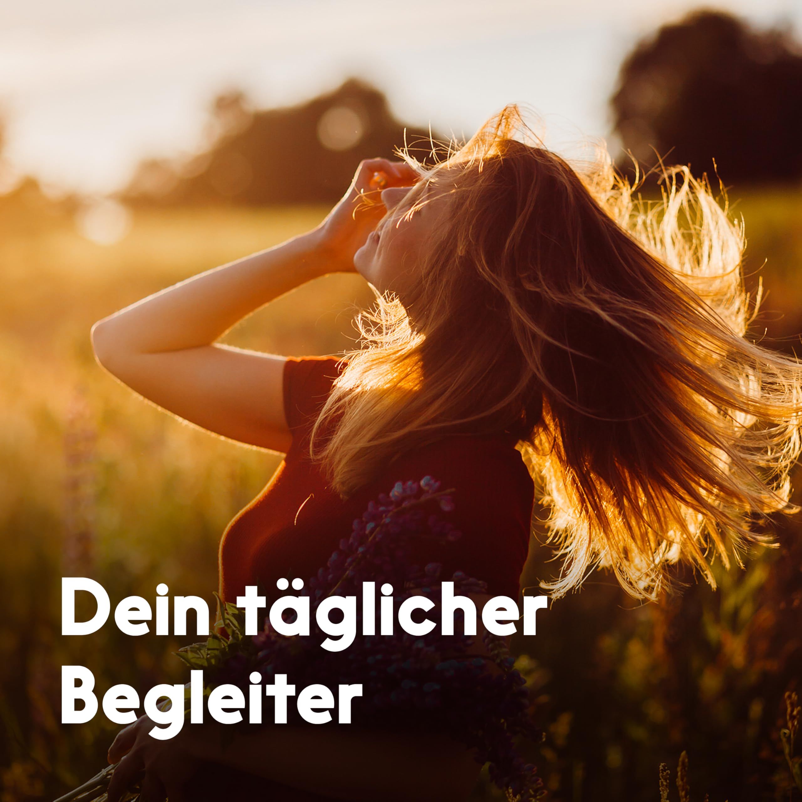Eine Frau im Freien, mit wehenden Haaren. Text: Dein täglicher Begleiter.