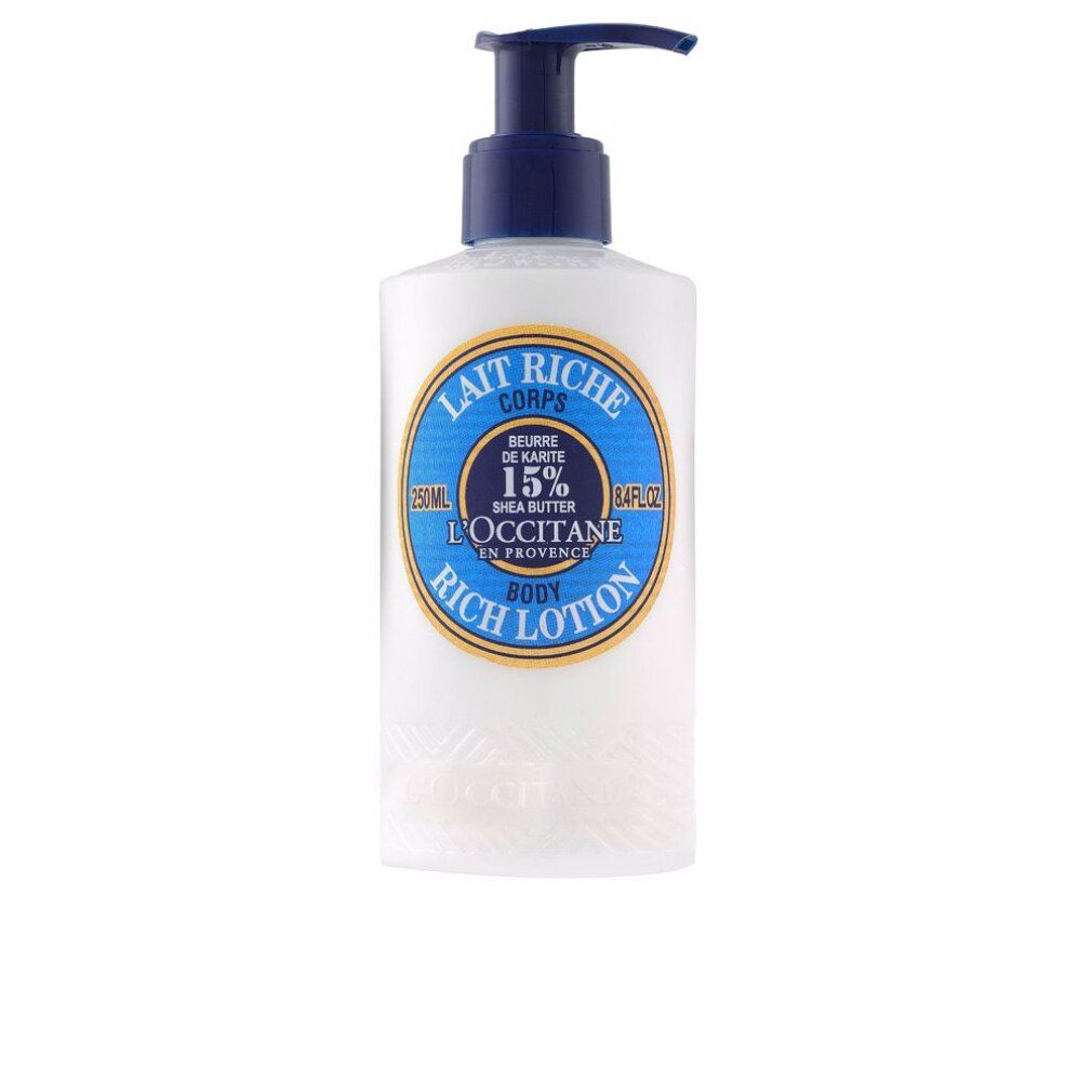 Weiße Flasche mit blauem Pumpkopf. Aufkleber mit Text: Lait Riche Corps, 15% Shea Butter, L'Occitane, Rich Lotion.