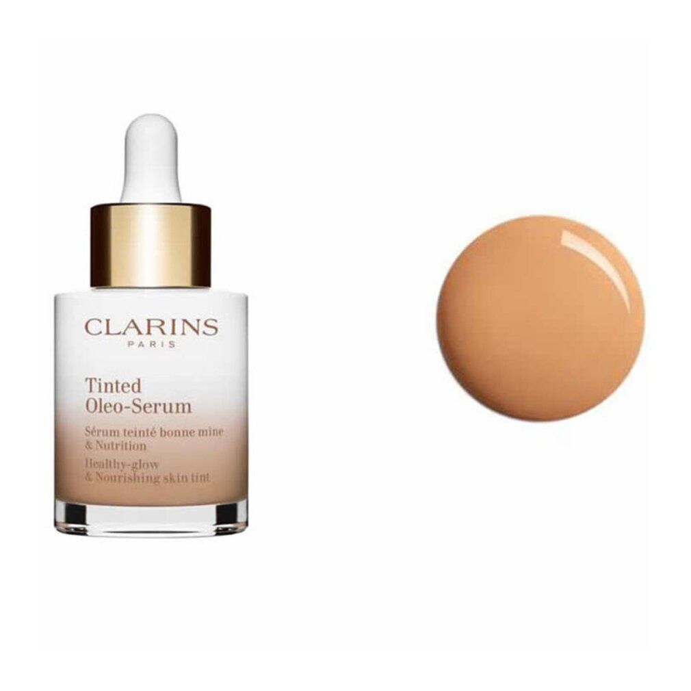 Flakon mit Pipette und getönter Flüssigkeit. Aufschrift: Clarins Paris, Tinted Oleo-Serum. Farbklecks.