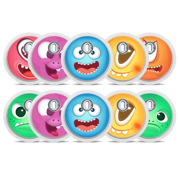 Mehrere runde Aufkleber mit Monstergesichtern. Verschiedene Farben und Ausdrücke. Mit silbernen Applikatoren.