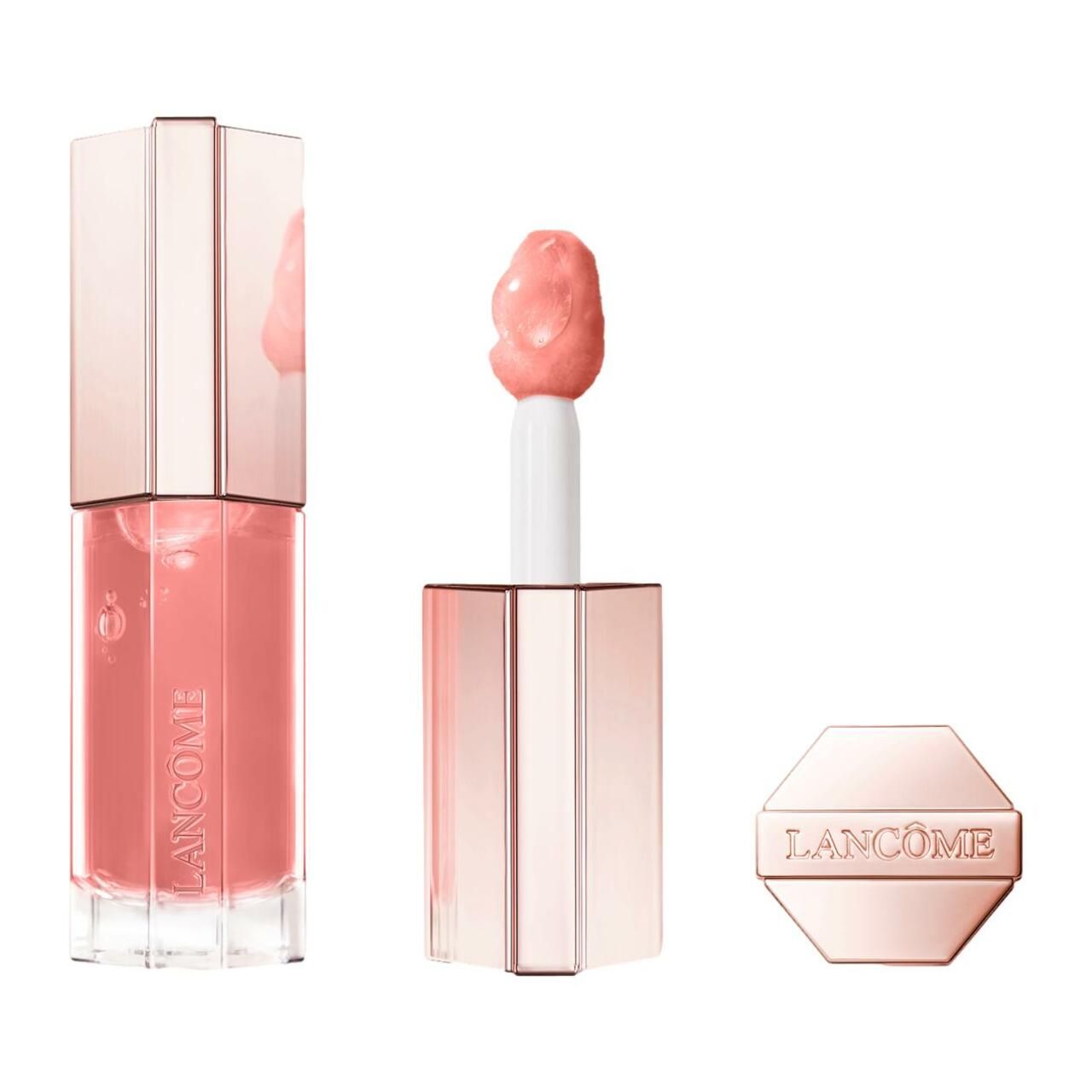 Lippenpflege-Produkt. Rosa Flüssigkeit in einem transparenten Behälter mit rosafarbenem Deckel. Der Applikator ist sichtbar.