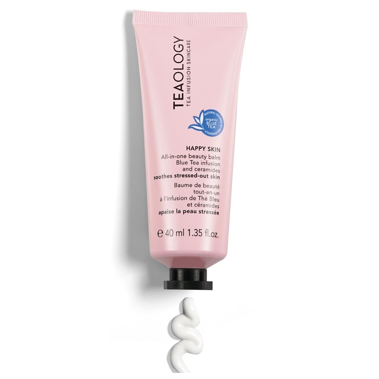 Rosa Tube mit schwarzem Verschluss. Aufschrift: Teaology, Happy Skin, All-in-one beauty balm. Auslaufende Creme.