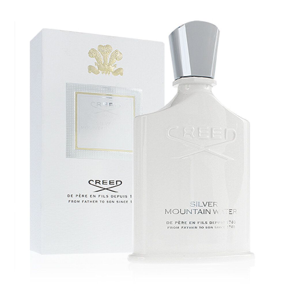 Weiße Parfumflasche und Verpackung. Aufschrift: Creed Silver Mountain Water. Flasche mit silbernem Verschluss.