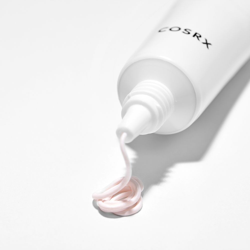 COSRX AC Collection Ultimate Spot Cream mit einer Probe auf weißem Hintergrund.