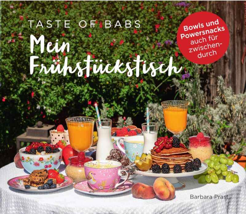 Buchcover mit dem Titel "Mein Frühstückstisch". Auf einem Tisch sind Frühstückszutaten und Getränke arrangiert.