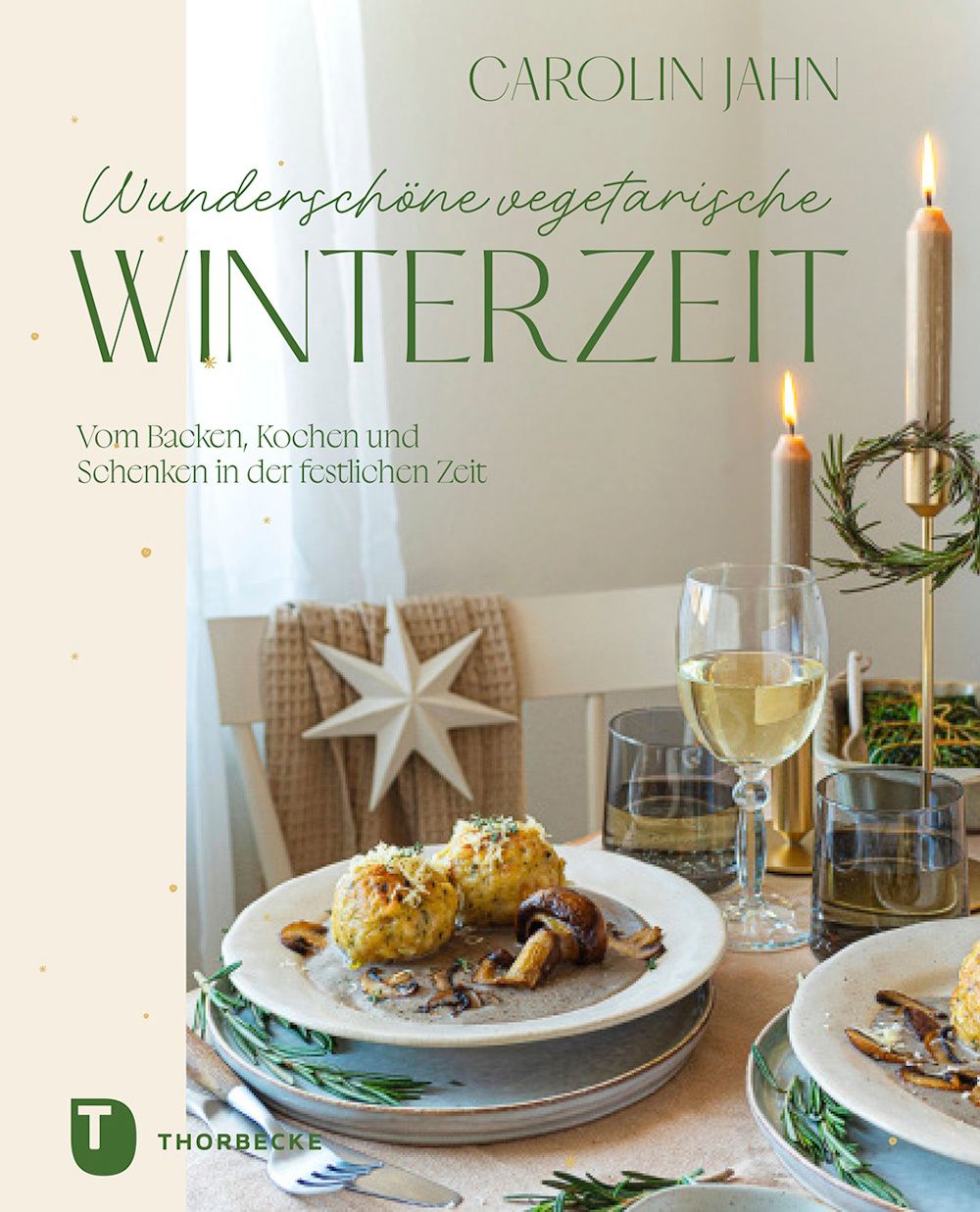 Buchcover mit Titel "Wunderschöne vegetarische Winterzeit" von Carolin Jahn. Auf einem Tisch mit Essen und Kerzen.