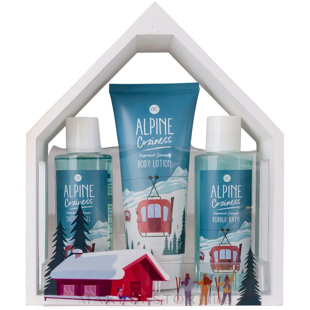 Badeset in weißem Hausrahmen. Enthält Duschgel, Schaumbad und Bodylotion. Illustration: Seilbahn, Berge, Haus.