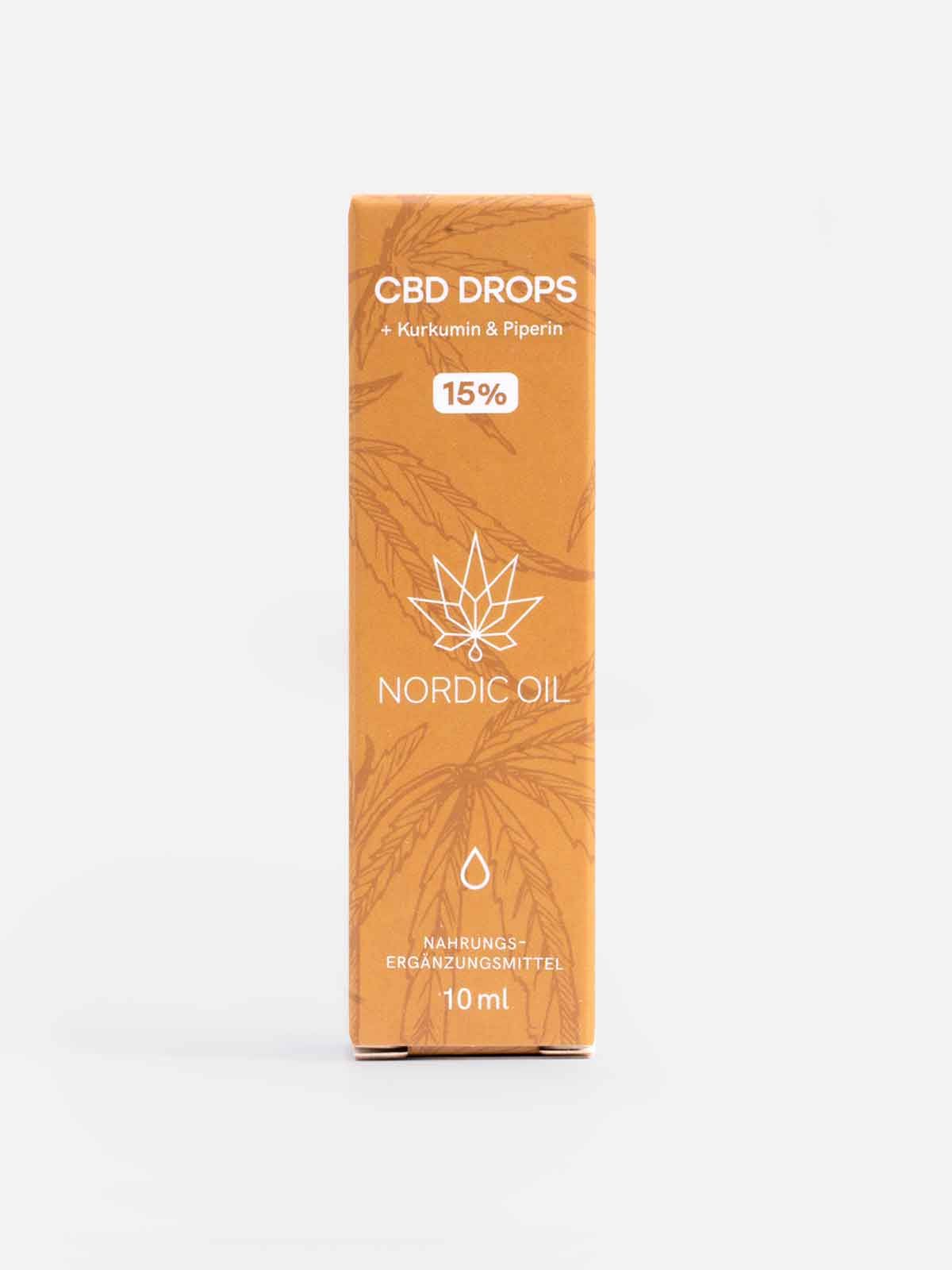 Braune rechteckige Verpackung. Text: CBD DROPS, 15%, Nordic Oil, 10 ml. Blätter- und Tropfen-Illustrationen. Nahrungsergänzungsmittel.