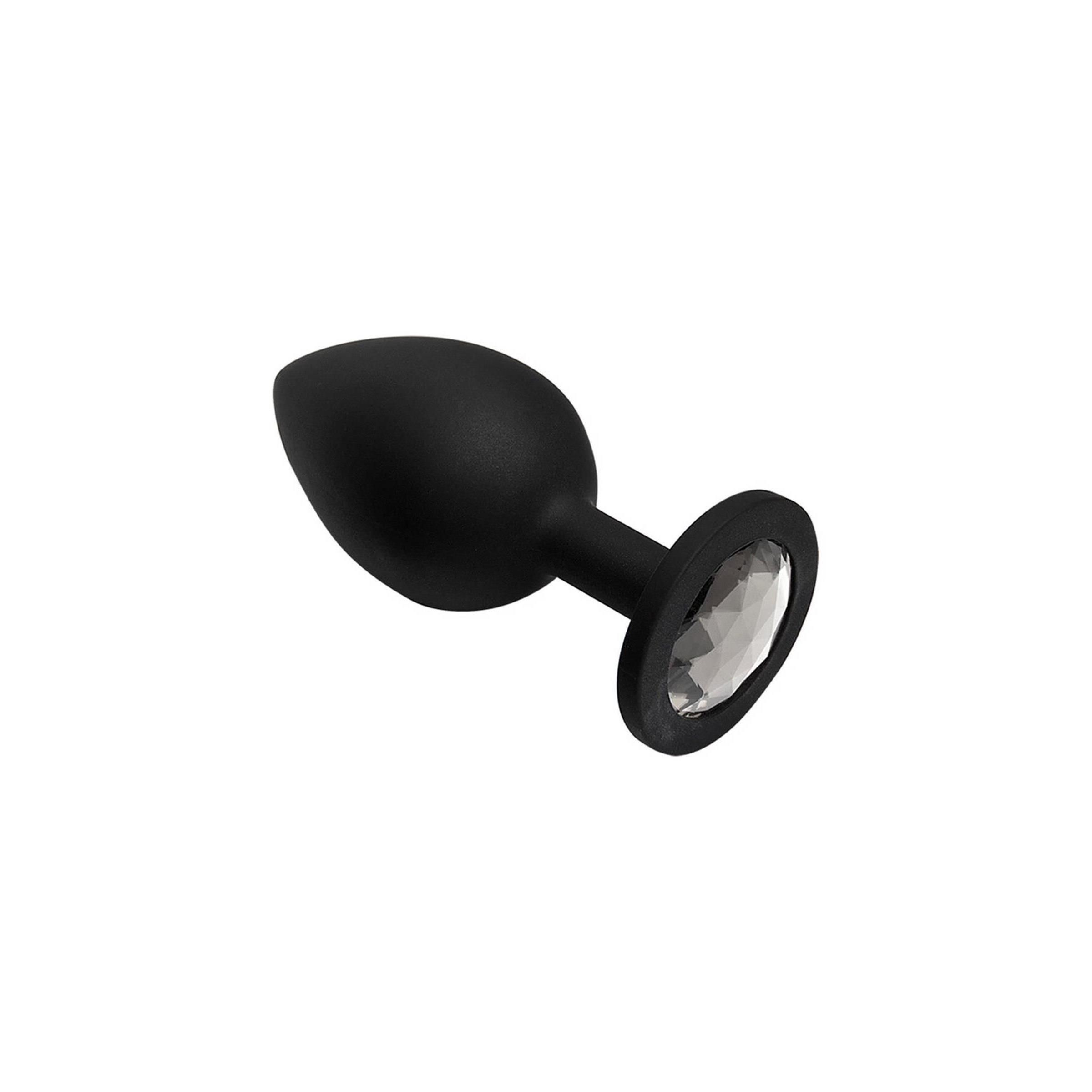 Schwarzer Plug mit Tropfenform und Kristall am Ende. Runde Basis mit Kristall. Auf weißem Hintergrund.