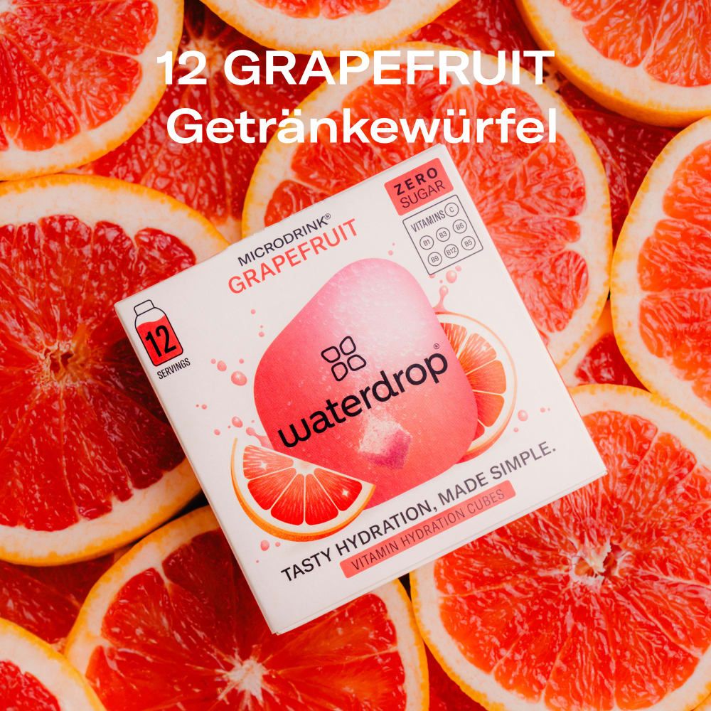 waterdrop® Microdrink Grapefruit Getränkewürfel, 12 Portionen, zuckerfrei, umgeben von Grapefruitscheiben.