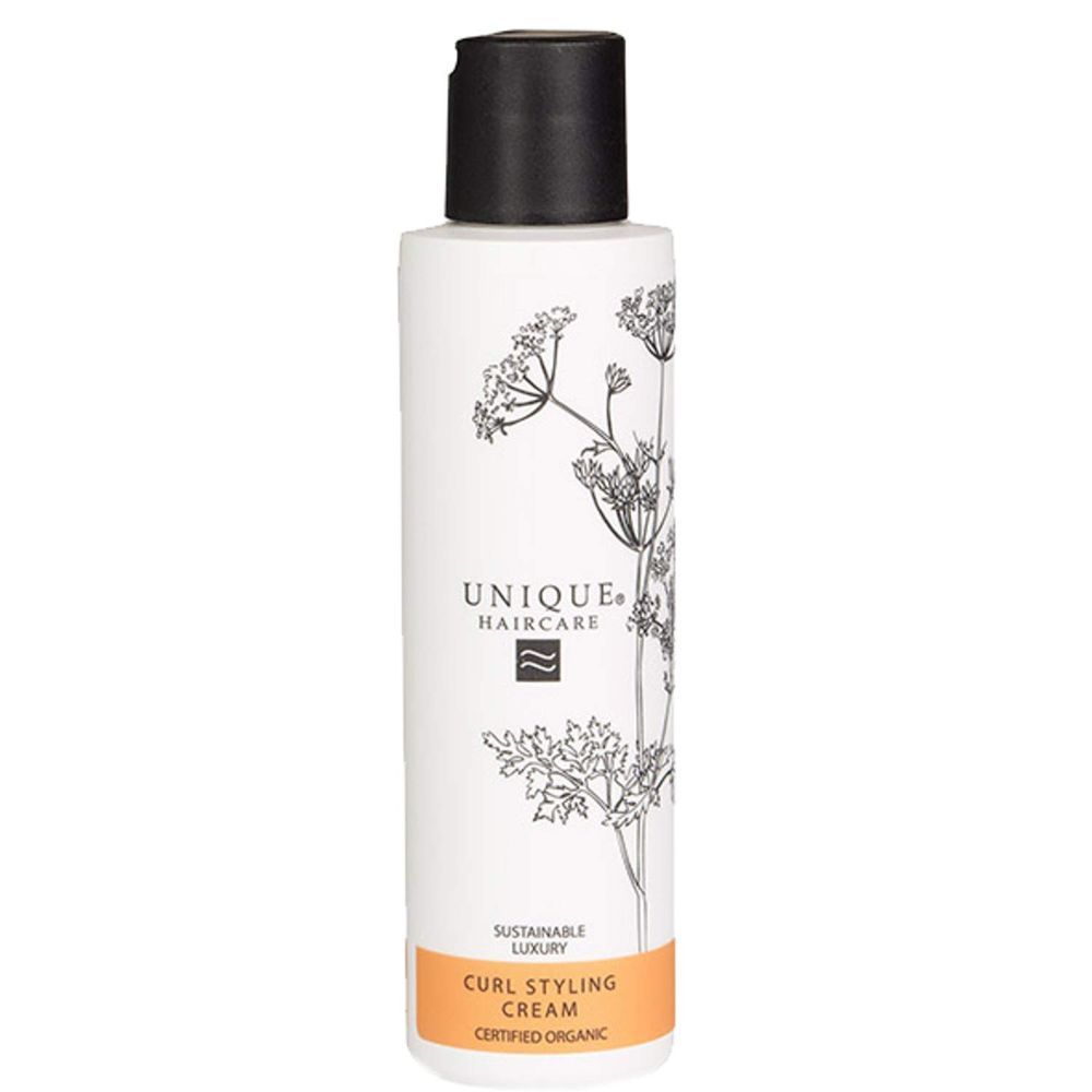 Weiße Flasche mit schwarzem Deckel. Aufschrift: UNIQUE HAIRCARE, CURL STYLING CREAM, CERTIFIED ORGANIC.