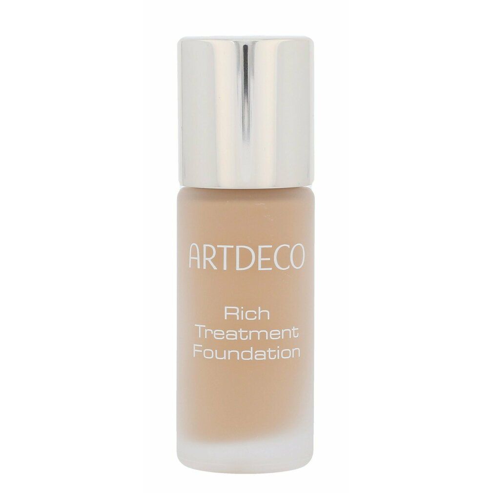 Artdeco Rich Treatment Foundation Flasche. Flasche mit silbernem Deckel, Schriftzug. Produktname deutlich sichtbar.