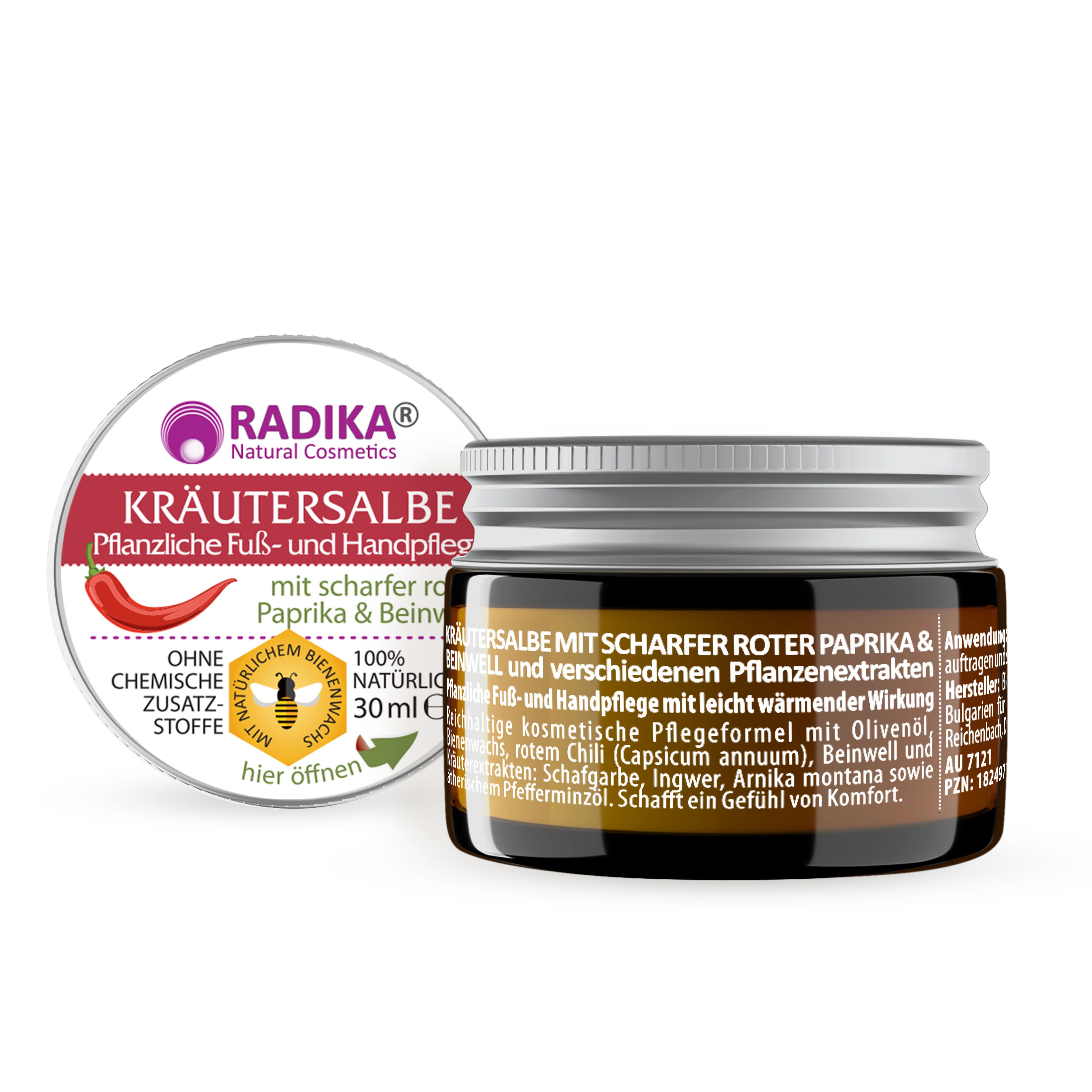 Braunes Glas mit Kräutersalbe, silbernem Deckel und Etikett. Daneben ein Deckel mit Produktinformationen und roter Paprika-Illustration.