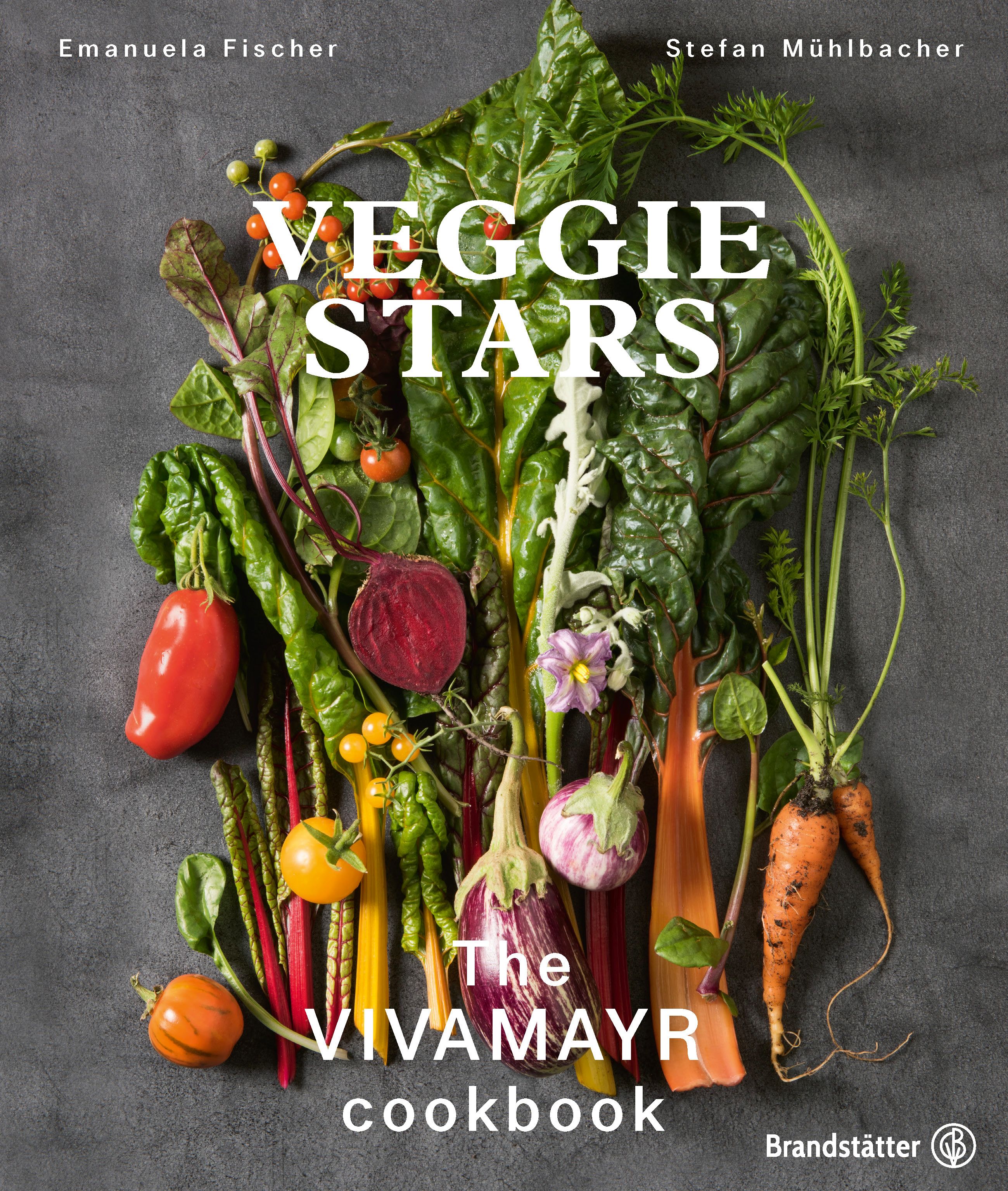 Kochbuch mit dem Titel "Veggie Stars". Autoren: Emanuela Fischer, Stefan Mühlbacher. Auf dem Cover Gemüse und der Titel "The Vivamayr Cookbook".