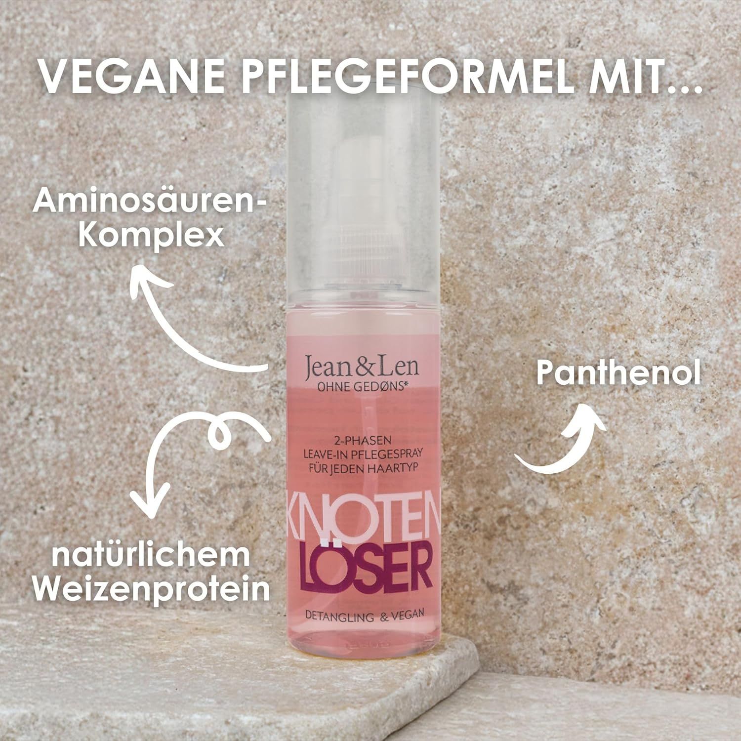 Transparente Sprühflasche mit rosa Flüssigkeit. Aufschrift: Jean & Len Knotenlöser. Pfeile zeigen auf Inhaltsstoffe: Aminosäuren, Weizenprotein, Panthenol.