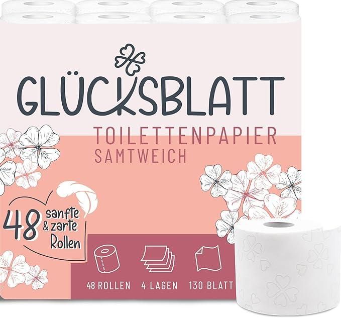 Packung Glücksblatt Toilettenpapier Sanftweich. 48 Rollen, 4 Lagen, 130 Blatt. Einzelne Rolle daneben.