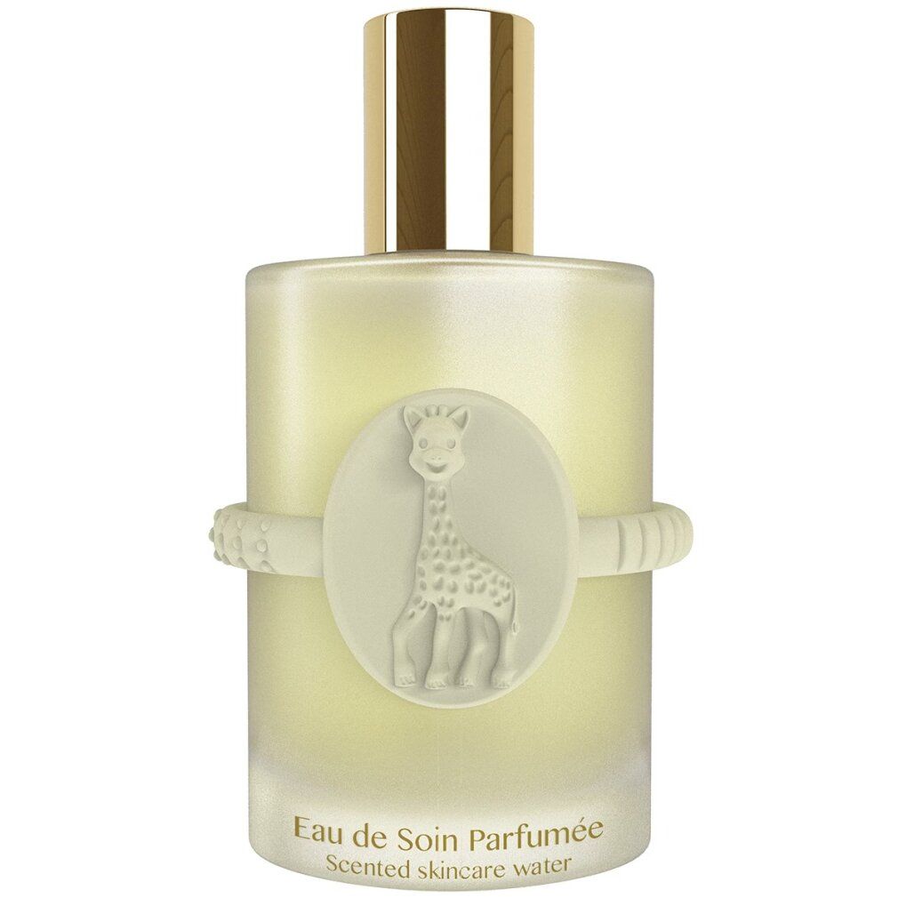 Parfümflakon mit Giraffen-Emblem. Text: Eau de Soin Parfumée, Scented Skincare Water. Weißes Band mit Noppen. Goldfarbener Verschluss.