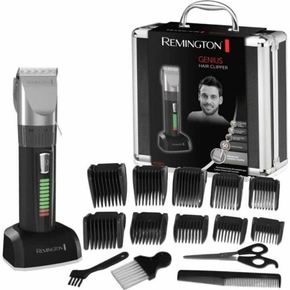 Haarschneider-Set mit Ladestation, Aufsätzen, Schere, Kamm und Reinigungsbürsten. Verpackung mit Produktabbildung.