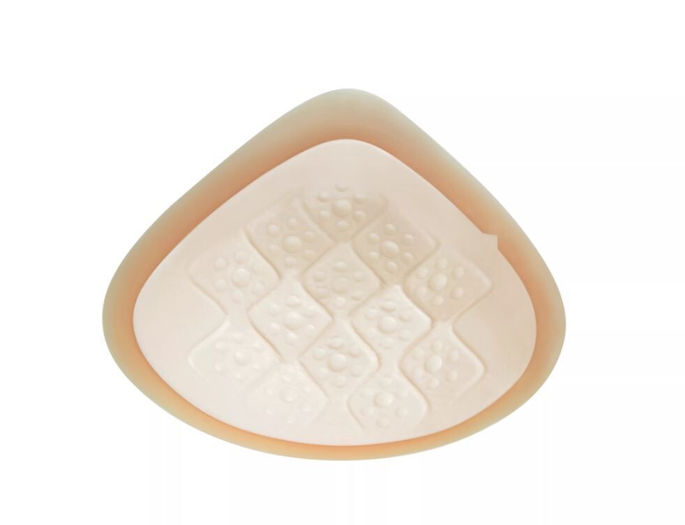 Dreieckige Ausgleichsepithese. Beige, mit Luftkammern. Oberfläche mit erhabenen Elementen.