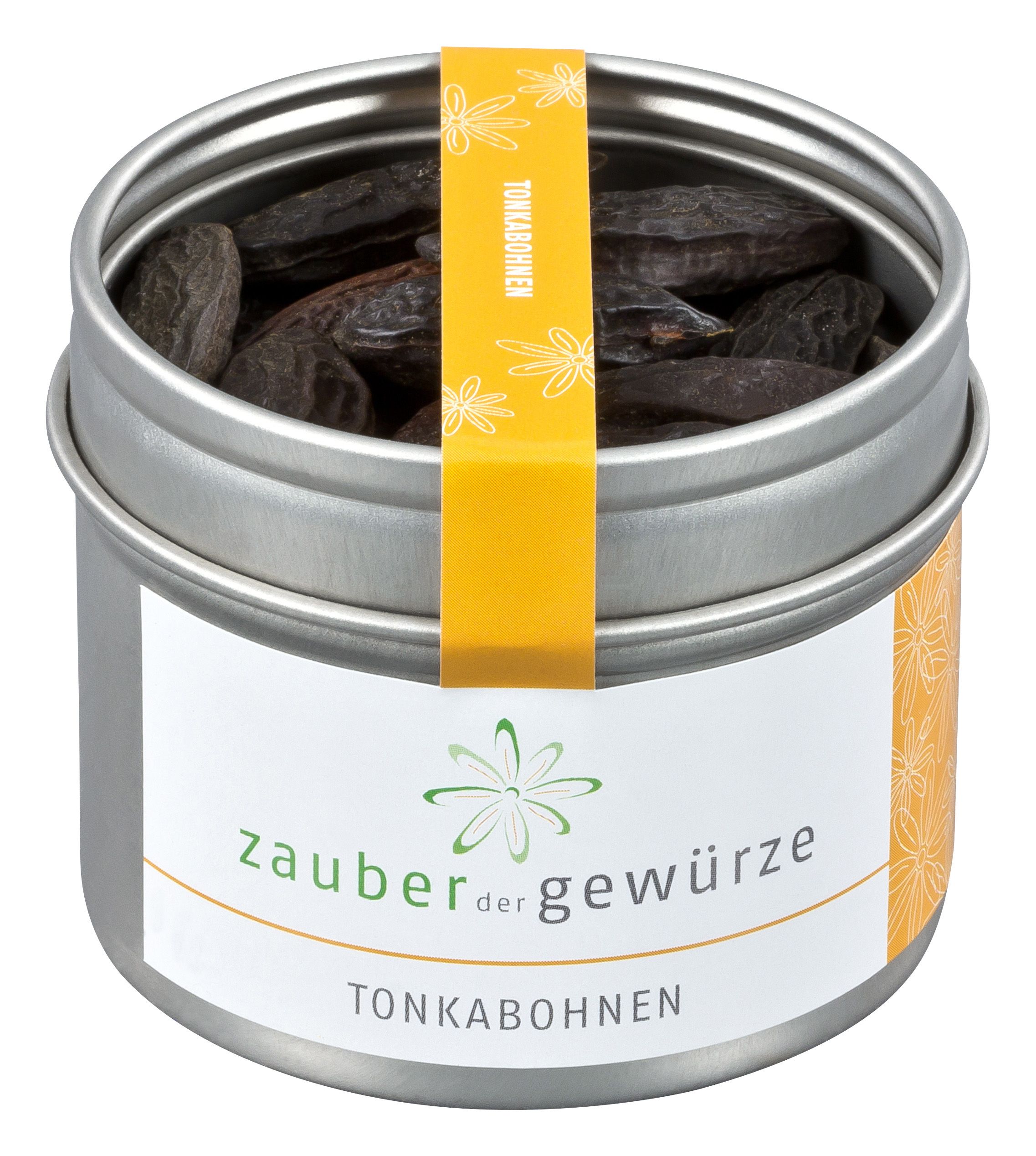 Metallbehälter mit Tonkabohnen. Aufkleber mit "Zauber der Gewürze" und "Tonkabohnen". Gelber Streifen mit "Tonkabohnen".