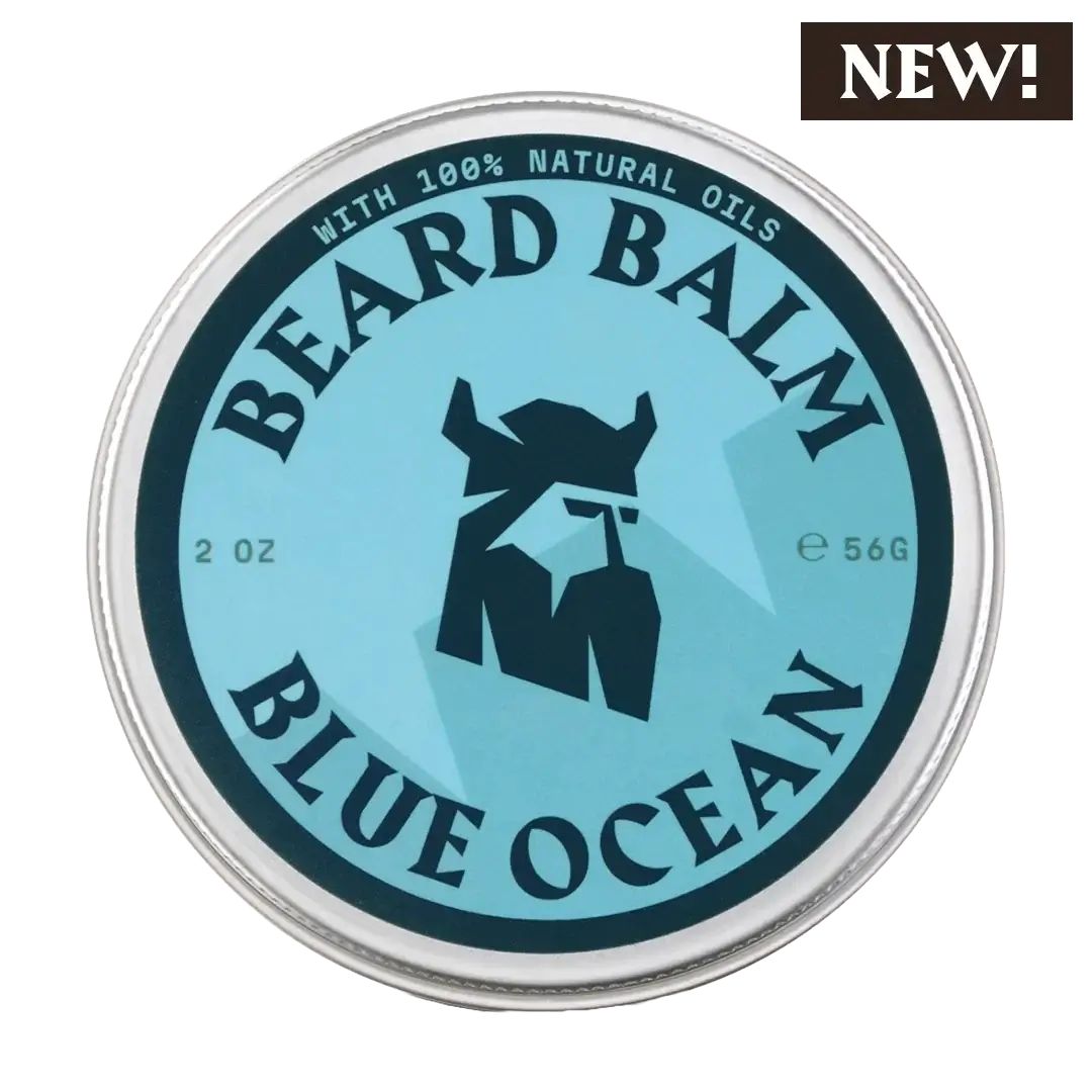 Runde Dose mit blauem Etikett. Aufschrift: BEARD BALM, BLUE OCEAN. Logo: Wikingerkopf. Text: WITH 100% NATURAL OILS, 2 OZ, e 56G. Aufkleber: NEW!