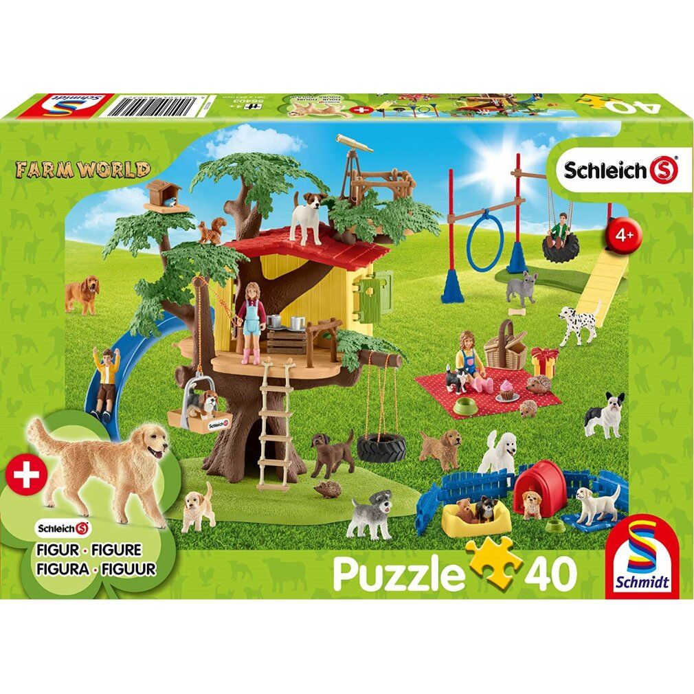 Schachtel mit Schleich Happy Dogs Puzzle, 40 Teile, und Figur. Enthält Hunde, Spielplatz, Baumhaus, Rutsche, und Zubehör. Marke: Schmidt.