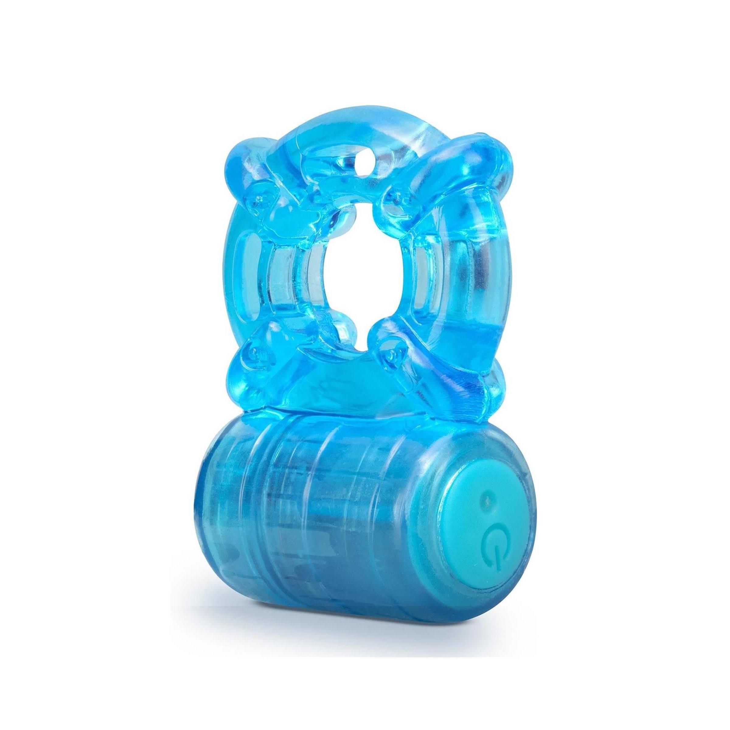 Blauer Cockring mit zwei Ringen und einem zylindrischen Teil. Ein Knopf mit einem Symbol ist sichtbar.
