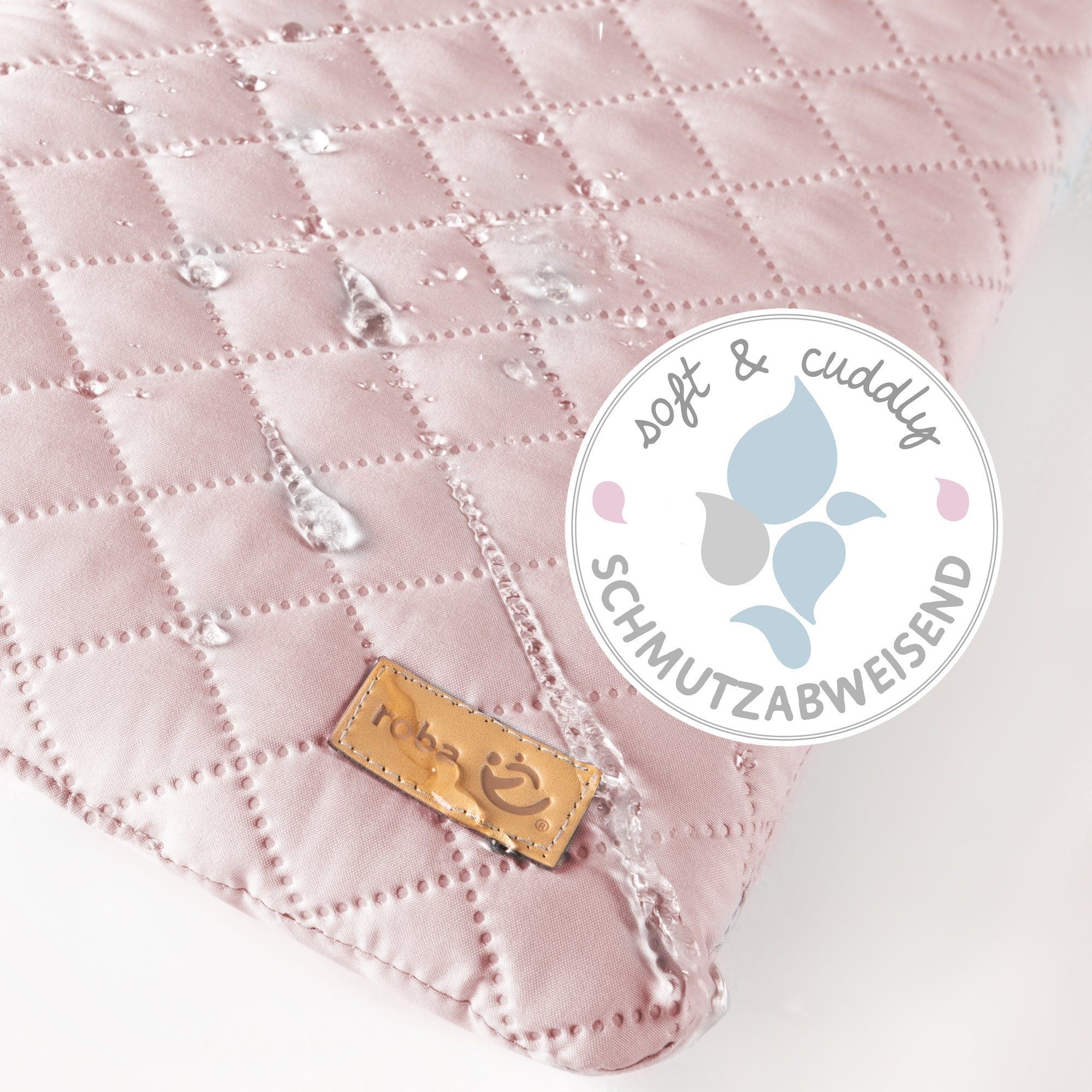 Rosa Wickelauflage mit quadratischem Steppmuster. Label. Wasserabweisend. Logo und Siegel.
