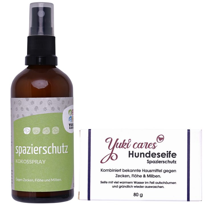 Braune Sprühflasche und Seife. Auf der Flasche steht 'spazierschutz'. Auf der Seife steht 'Yuki cares Hundeseife'.