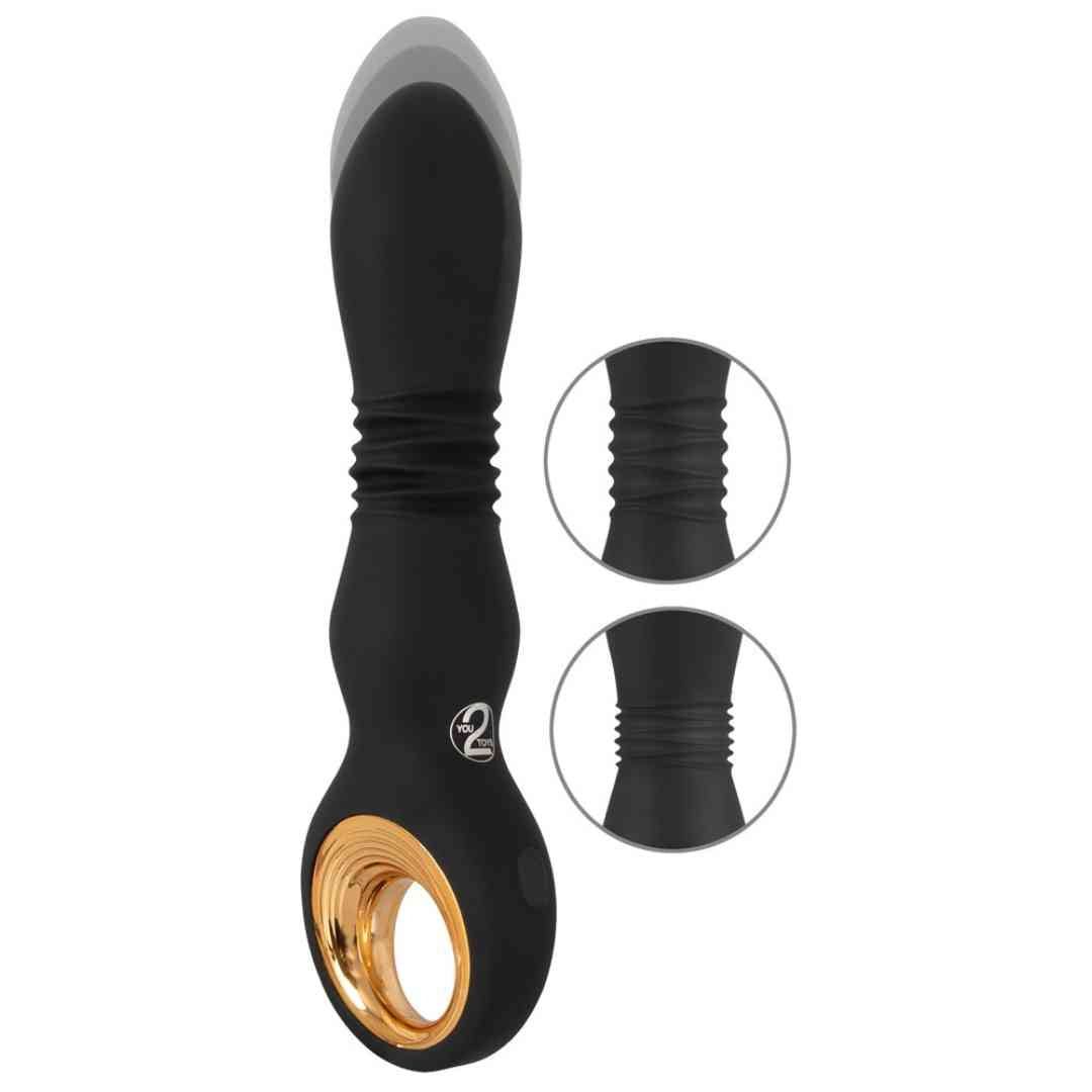 Schwarzer Vibrator mit goldfarbenem Ring. Geriffelte Mitte, ovale Form, Kreis mit Zahl 2.