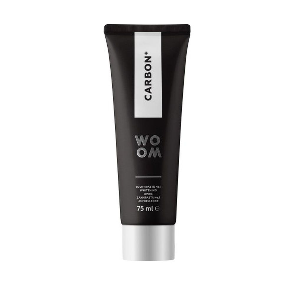 Schwarze Tube mit weißem Aufdruck: CARBON+ und WOOM. Silberfarbener Verschluss. Text: Zahnpasta Nr. 1, 75 ml.