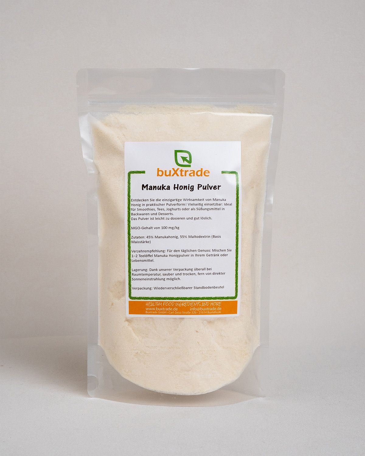 Beutel mit Pulver, Etikett mit Produktname 'buXtrade Manuka Honig Pulver'.