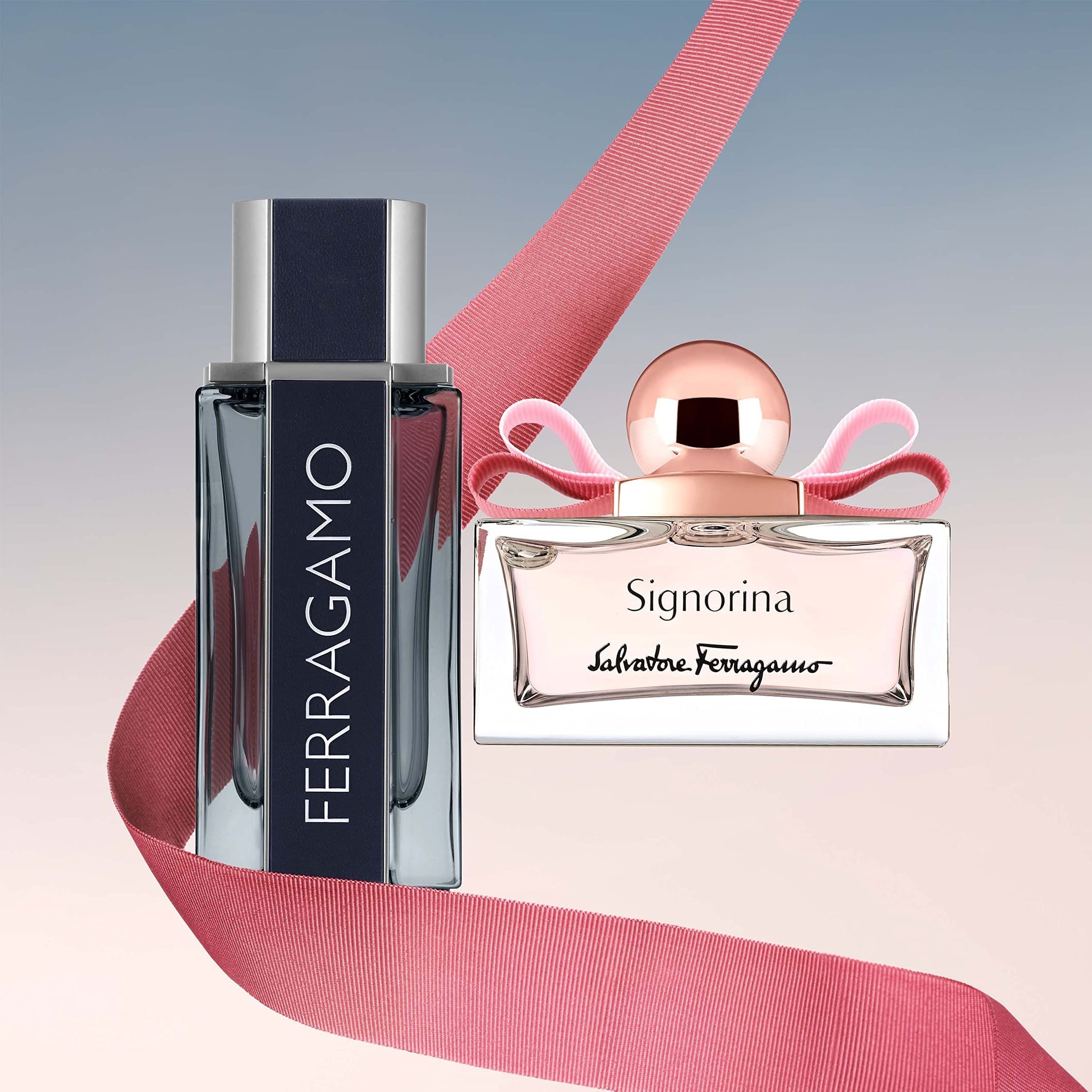 Zwei Parfümflakons. Signorina Eau de Parfum und ein rechteckiger Flakon mit blauem Etikett. Rosa Band.