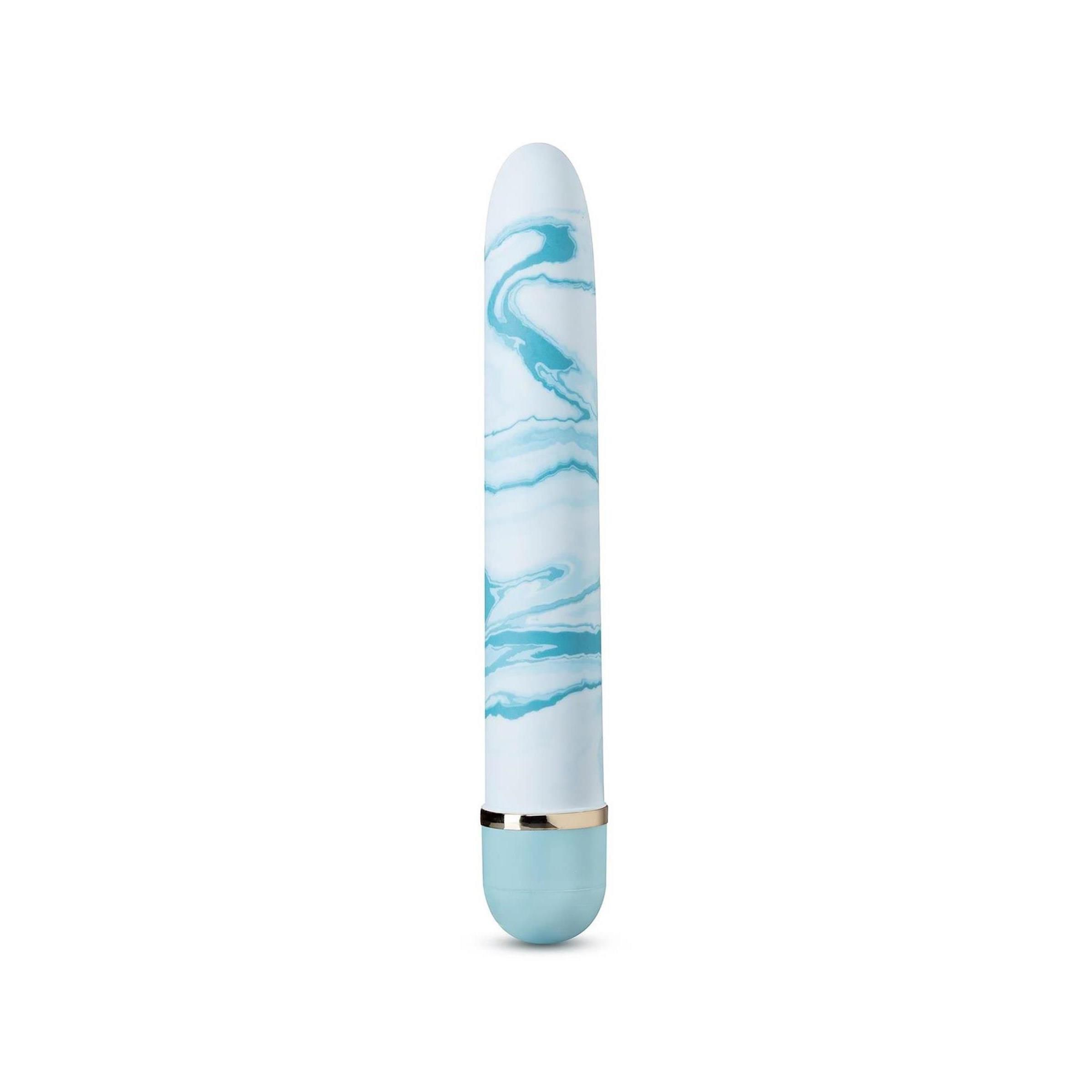 Zylindrisches Wellness-Produkt mit blau-weißem Marmormuster. Abgerundete Enden, goldfarbener Ring, hellblauer Abschluss.