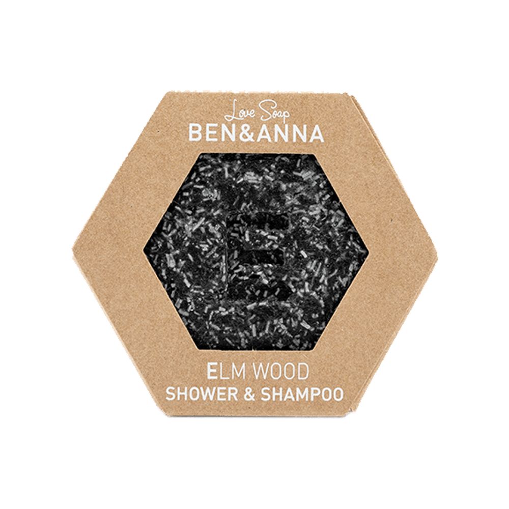 Sechseckige Seife in Pappverpackung. Sichtbar: schwarze Seife mit 'E'. Text: BEN & ANNA, ELM WOOD, SHOWER & SHAMPOO.