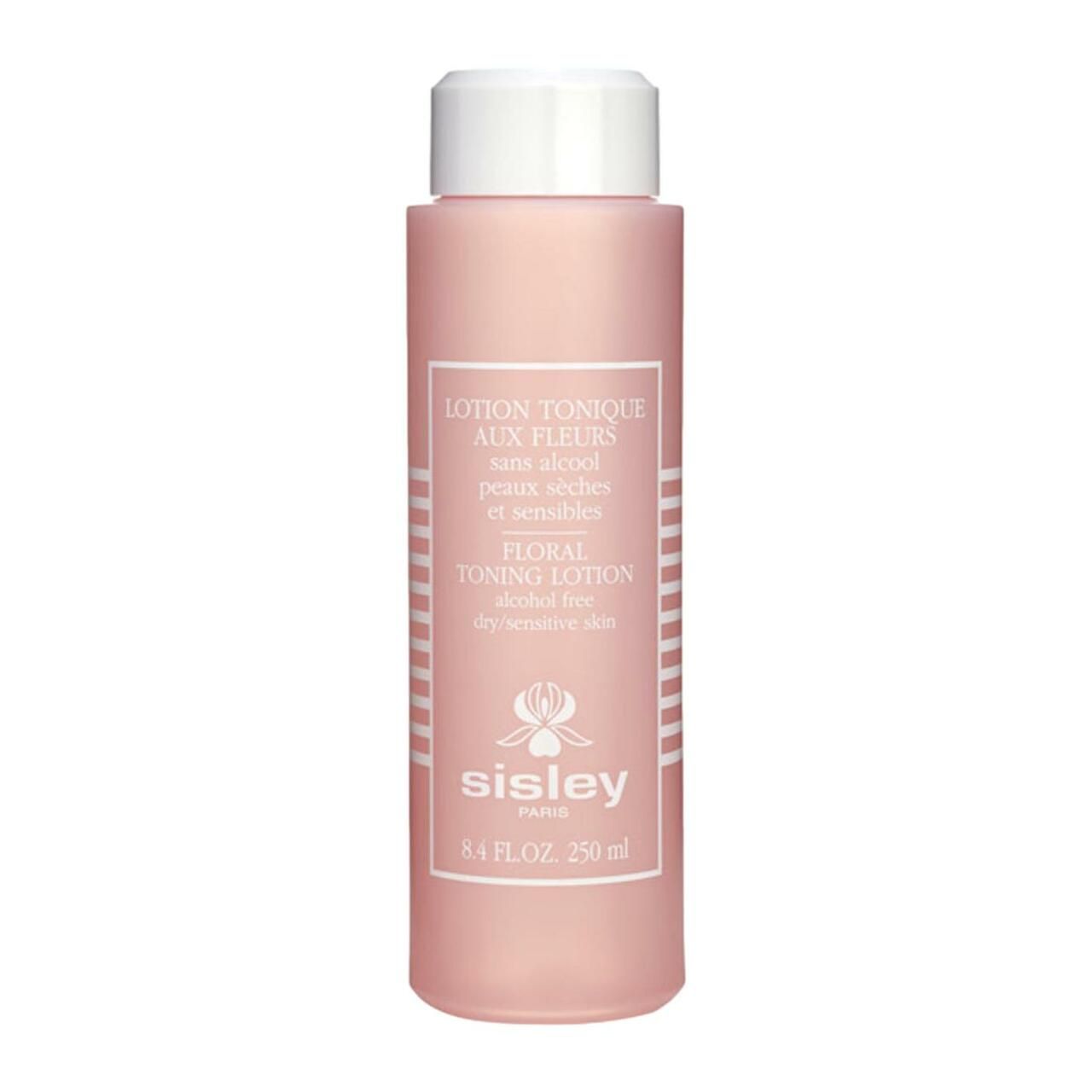 Rosa Flasche mit weißem Deckel. Aufschrift: Lotion Tonique aux Fleurs, Sisley. Für trockene, empfindliche Haut.
