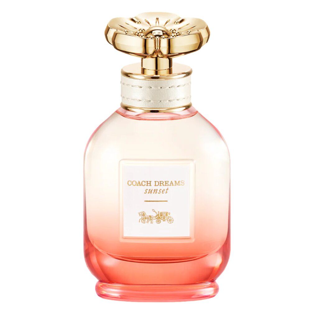 Parfümflakon mit goldenem Deckel. Aufschrift: COACH DREAMS sunset. Farbverlauf von rosa nach transparent.