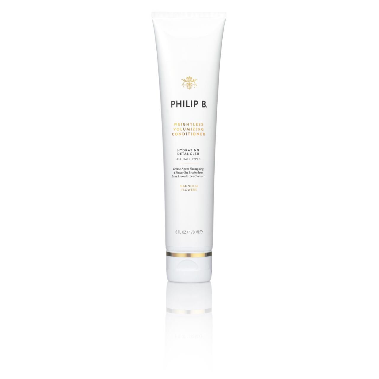 Weiße Tube mit goldfarbenen Akzenten. Aufschrift: Philip B, Weightless Volumizing Conditioner. Text: Hydrating Detangler, All Hair Types.