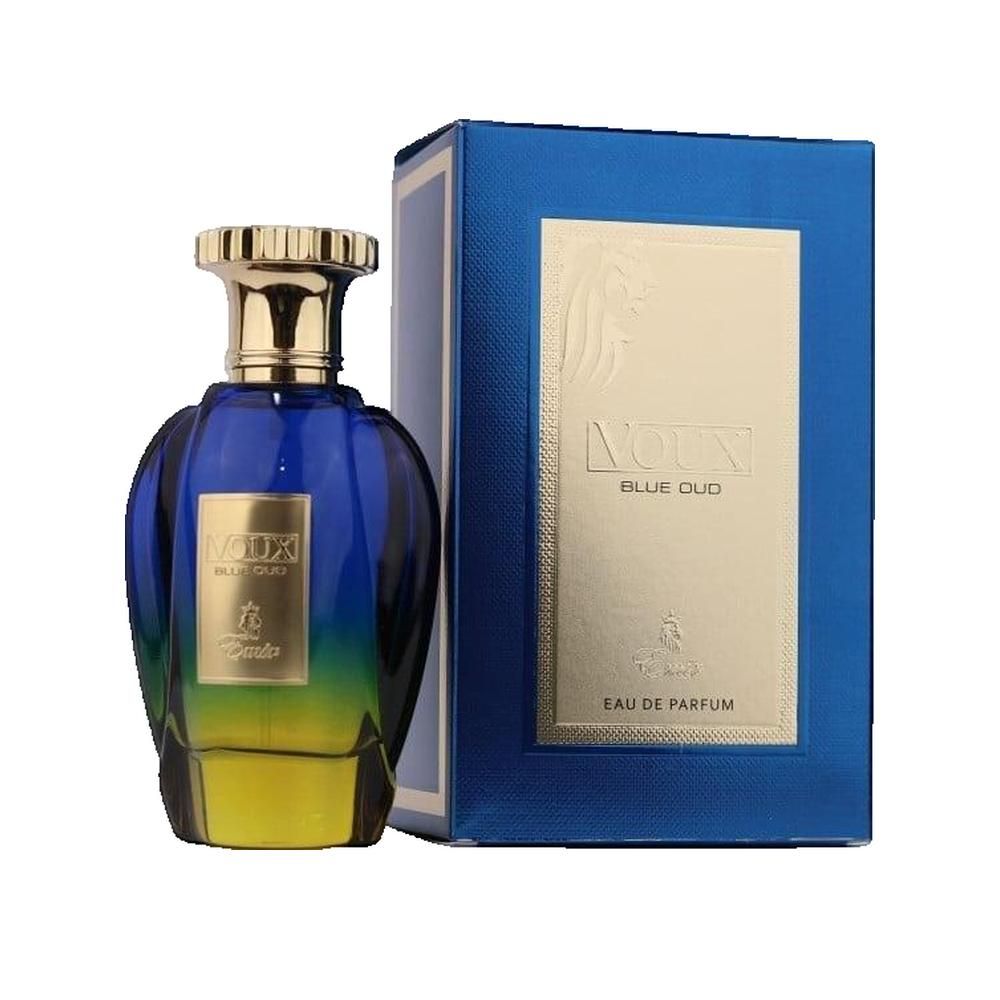 Blau-gelbe Parfumflasche mit goldfarbenem Verschluss und blauer Verpackung. Aufschrift: Voux Blue Oud Eau de Parfum.