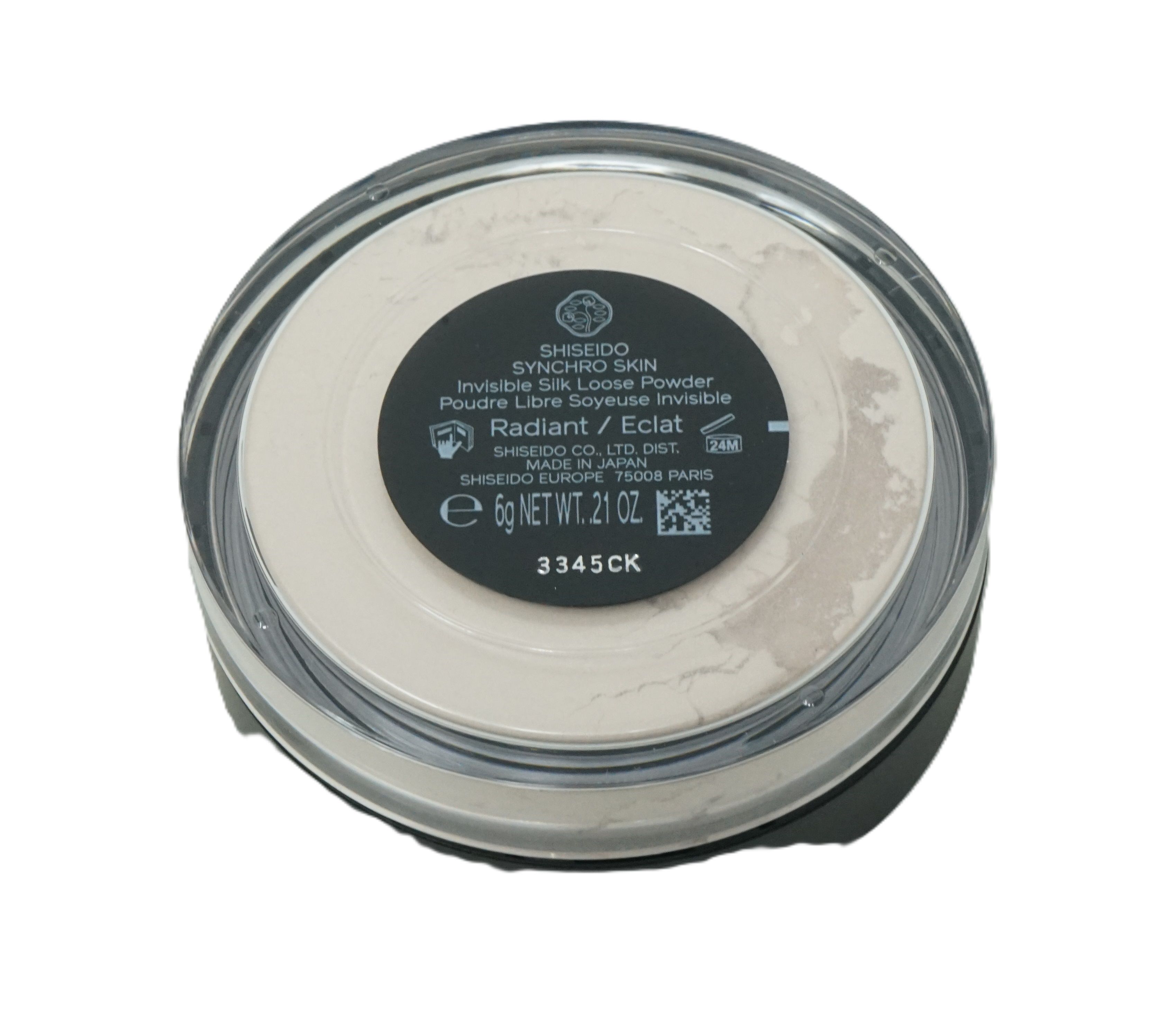 Runde, transparente Dose mit losem Puder. Schwarzer Deckel mit Produktinformationen. Marke: Shiseido. Inhalt: 6g.