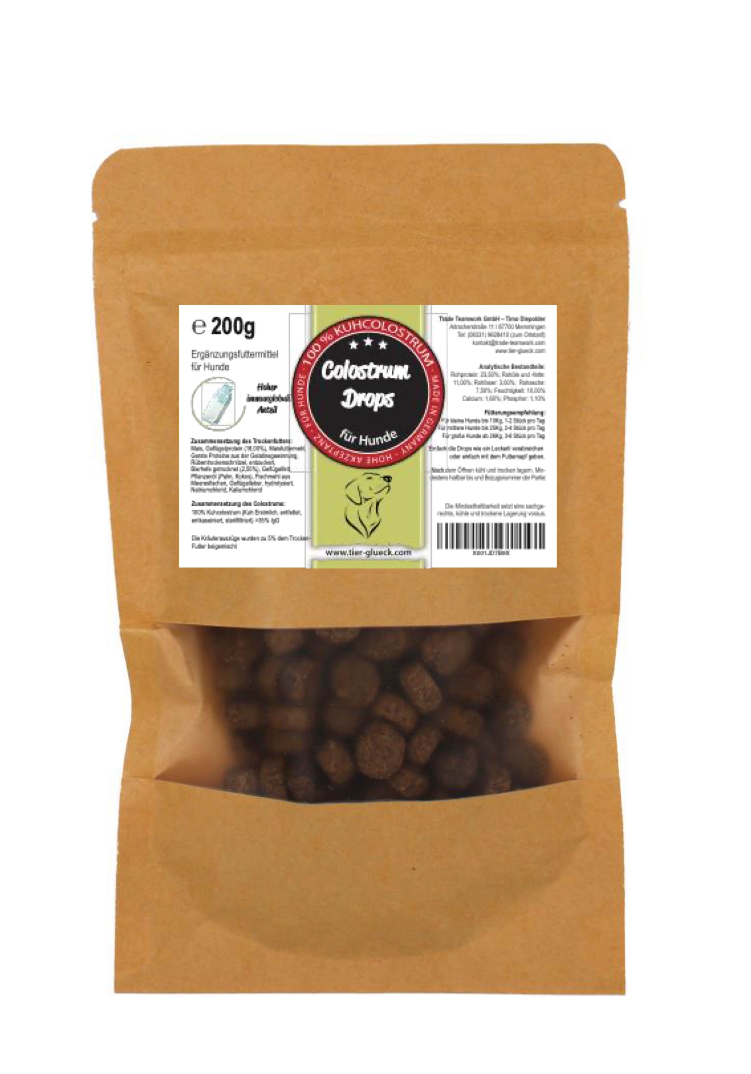 Beutel mit Colostrum Drops für Hunde. Sichtfenster zeigt braune Pellets. Aufdrucke mit Produktinformationen und Logo.