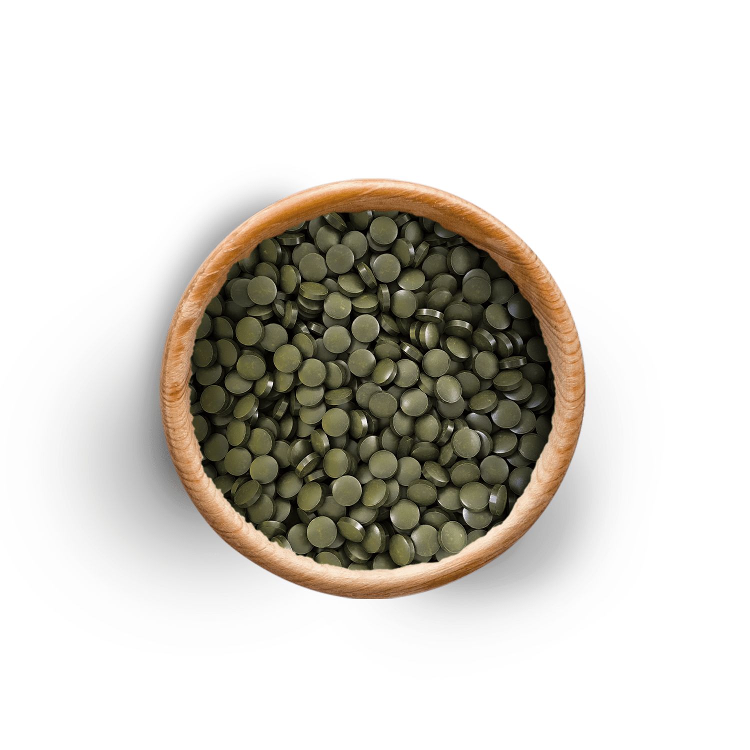 Holzschale gefüllt mit grünen Presslingen. Draufsicht.