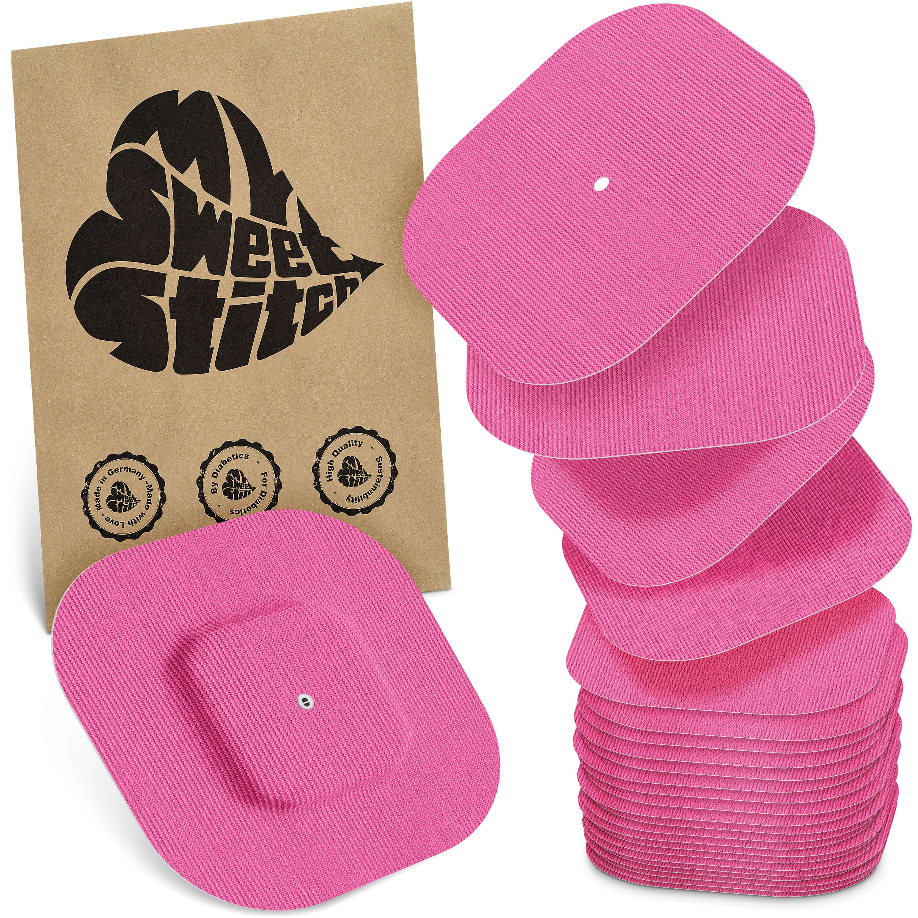 Rosa quadratische Pflaster mit einem kleineren quadratischen Mittelteil. Verpackung mit Logo und Qualitätssiegeln.