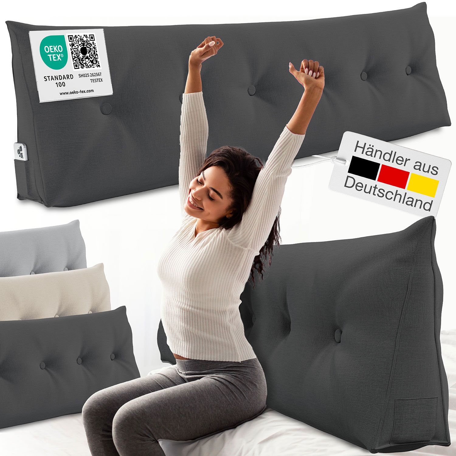 Graues Keilkissen mit Knöpfen. Frau dehnt sich daneben. Text: Oeko-Tex Standard 100. Händler aus Deutschland.