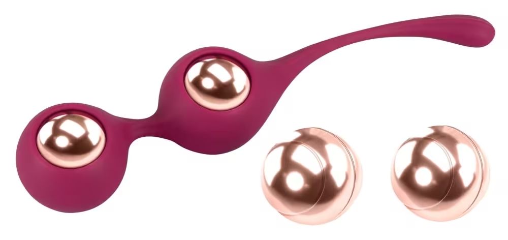 Zwei Kegel-Trainingskugeln mit zwei separaten Kugeln. Die Kugeln sind rosa und goldfarben. Die Kugeln sind verbunden und haben eine längliche Form.