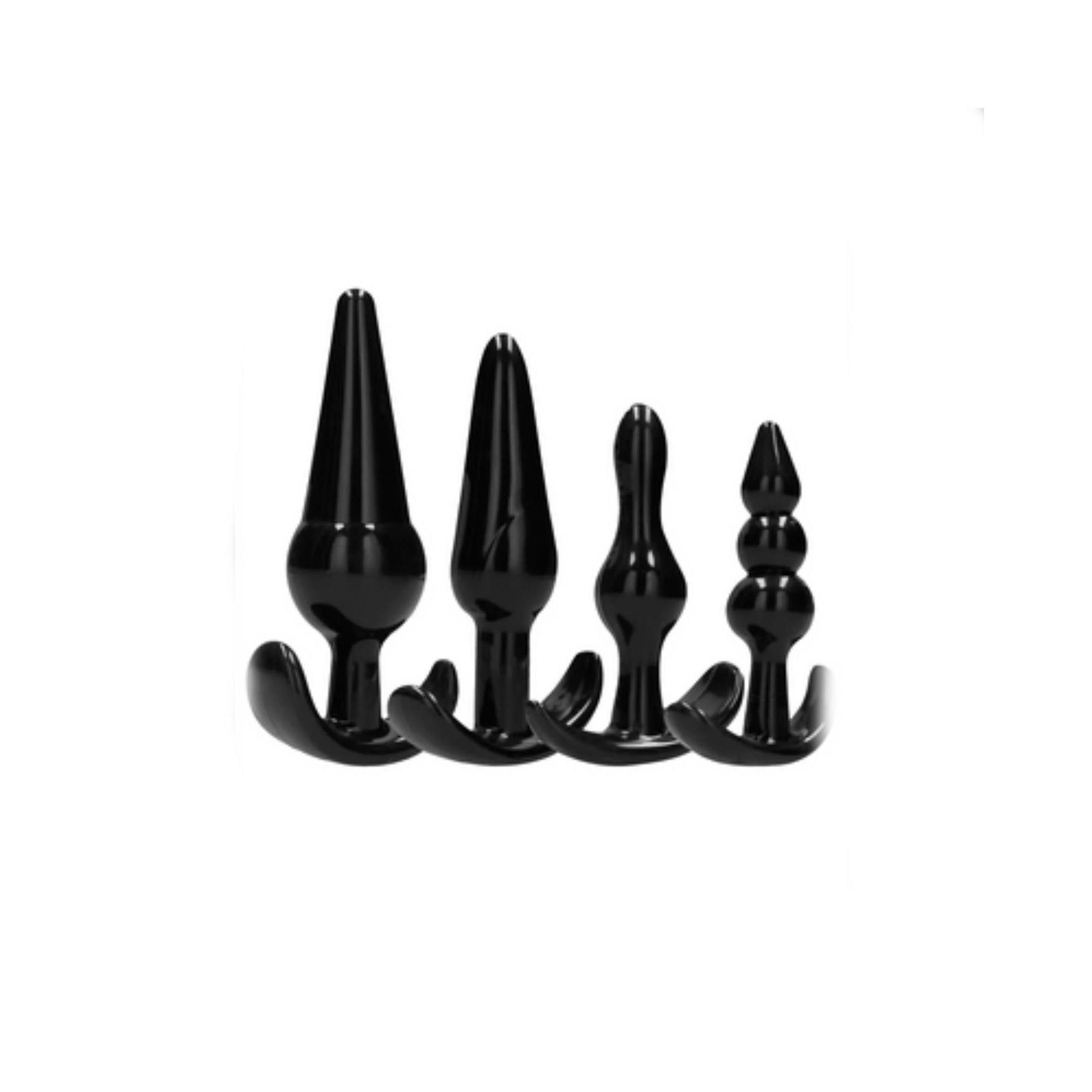 Vier schwarze Anal-Plugs in verschiedenen Formen. Alle mit Basis.