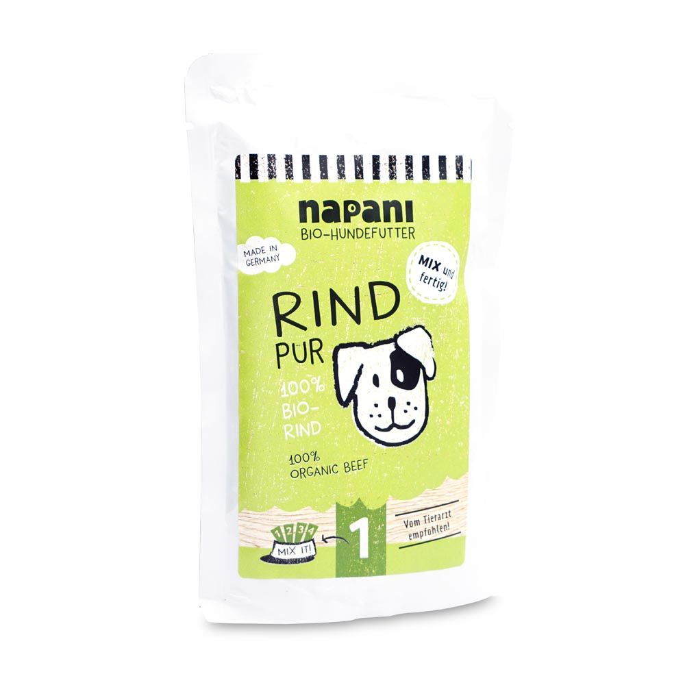 Verpackung von napani Bio-Dosenfutter für Hunde, Rind pur. Grün-weißes Design mit Produktinformationen und Hunde-Illustration.